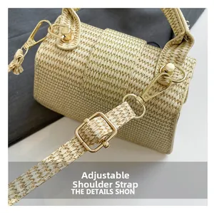 Detail of adjustable woven shoulder strap with gold metal buckle on a beige handbag