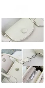Detail of white lychee grain leather handbag featuring silver magnetic buckle and hardware