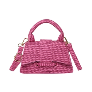 Pink woven textured small square handbag with hourglass curved base and shoulder strap
