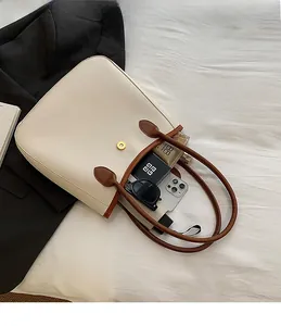 Interior view of tote bag showing spacious capacity for phone and cosmetics