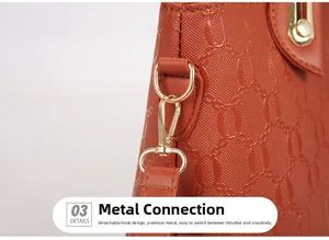 Macro detail of brown embossed leather bag showing golden metal hardware and strap hook