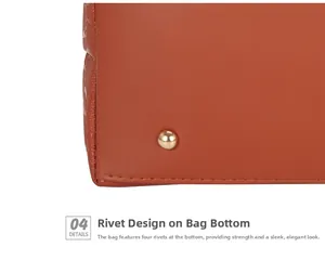 Detail of four light gold protective metal rivets on the bottom of the brown leather tote
