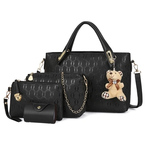 Black 4-piece embossed faux leather handbag set including tote and bear charm