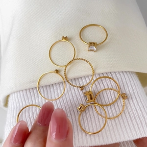 Set of minimalist 18K gold plated titanium steel rings with zircon and twist design
