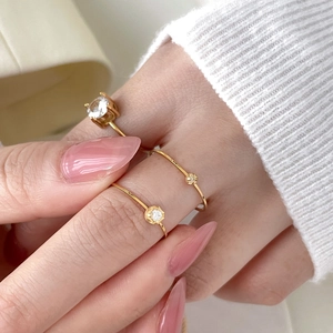 Three-piece 18K gold plated twisted band rings with four-prong set round cubic zirconia