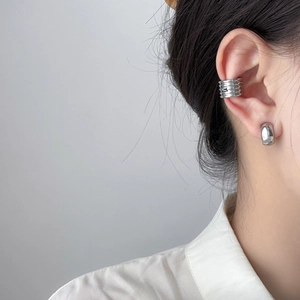 Minimalist geometric silver earrings set with layered ear cuff and polished hoop studs