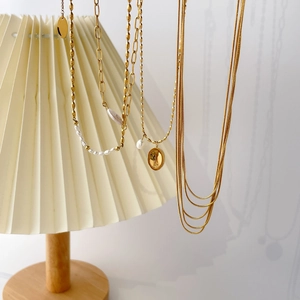Layered 18K gold plated titanium necklace set with freshwater pearls and oval pendant