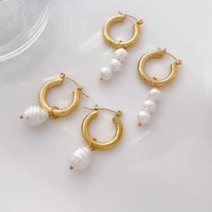 Gold-plated C-shaped hoop earrings with Baroque pearl drops and triple pearl clusters