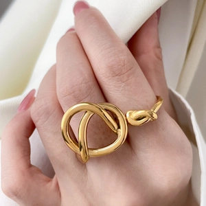 Artistic gold double-layered knotted ring in a minimalist twisted streamline design