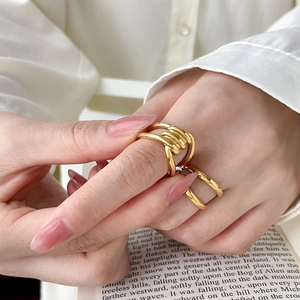 Abstract knotted 18K gold plated titanium steel rings with twisted double layer design