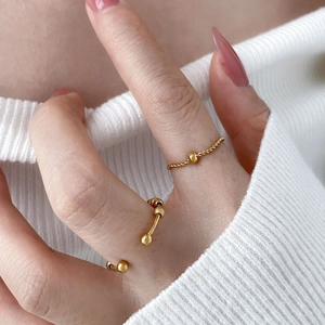 Minimalist 18K gold plated stackable beaded rings featuring twisted band and wave details