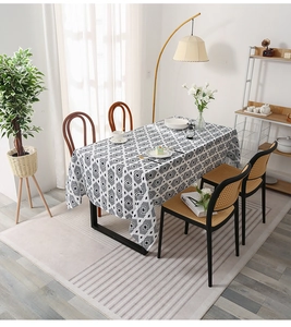 Detail of Nordic tablecloth featuring black and white geometric diamond patterns for dining decor