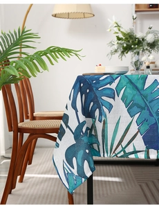 Close-up of tropical palm leaf pattern and woven texture on linen blend tablecloth
