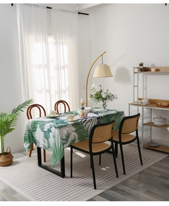 Close-up of modern oil-proof tablecloth with green tropical palm leaf print