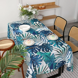 Nordic rectangular tablecloth featuring tropical monstera leaves in blue and green