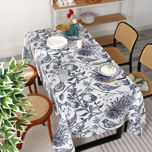 Nordic rectangular tablecloth featuring vintage blue floral and bird patterns on white fabric