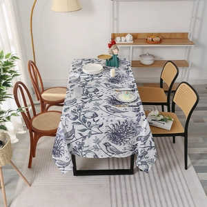 Nordic rectangular tablecloth with blue floral and bird patterns on a white base