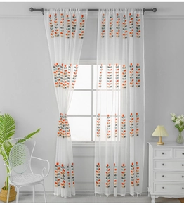 Detail of white sheer curtain with colorful leaf embroidery for bedroom lighting