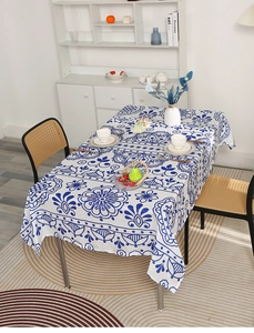 Detailed view of rectangle tablecloth with retro blue floral patterns in home setting