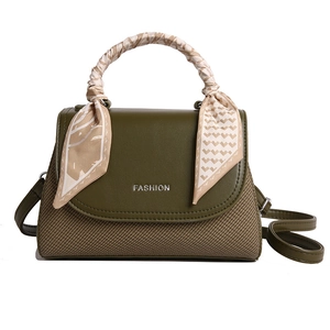 Olive green crossbody bag with fabric texture and silk scarf handle decoration