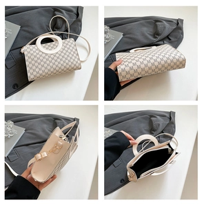 Detail view of beige crossbody bag showing M-pattern print and unique circular handle