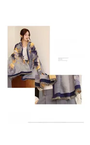 Close-up of imitation cashmere shawl with yellow floral prints and tassel fringe details