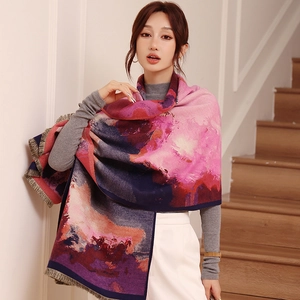 Detail of oil painting style scarf featuring thick cashmere-like fabric and tassels