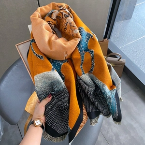 Artistic color-block cashmere scarf with elk motif, tassels, and high-density knit texture