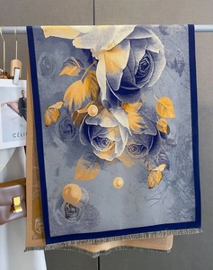 Detailed blue jacquard shawl with rose patterns, pearl accents and tassel edges