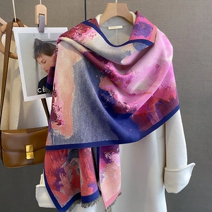 Thick cashmere-like scarf with abstract oil painting print and fringe edges on a coat