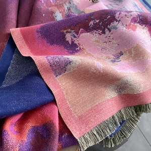 Detail of oil painting jacquard shawl showing soft cashmere-like texture and long fringes