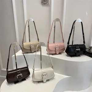 Chic women's leather baguette shoulder bags in multiple colors on a minimalist display