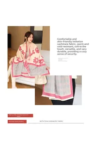 Detail of pink floral and grey geometric pattern cashmere scarf with fringe edges