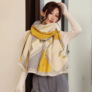 Detail of cashmere-like scarf showing vintage horse jacquard pattern and fringe edges