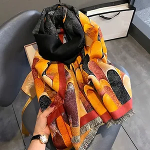 Cashmere-like scarf with warm geometric color blocks and fringe trim for autumn winter