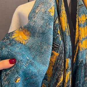 Thick oil painting style cashmere scarf with artistic blue and gold knit pattern texture