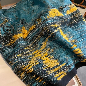 Close-up of thick oil painting style jacquard knit scarf with vivid Van Gogh textures