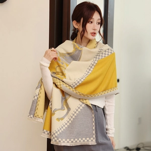 Detail of vintage horse carriage pattern and checkered border on thick cashmere-feel shawl
