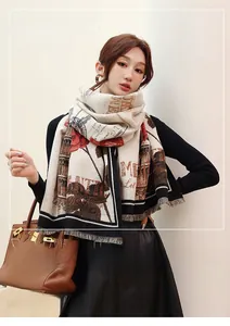 Detailed view of beige cashmere-like scarf featuring vintage red rose floral embroidery