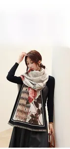 Detail of vintage cashmere-like scarf featuring Pisa Tower and red rose prints