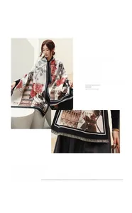 Detailed view of imitation cashmere scarf featuring red floral print and fringe tassels