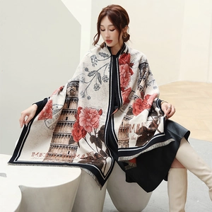 Detail of vintage style cashmere scarf featuring Leaning Tower print and tassel edges