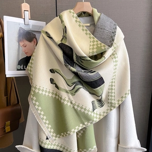 Close-up of double-sided horse pattern scarf with soft fringe and premium cashmere texture