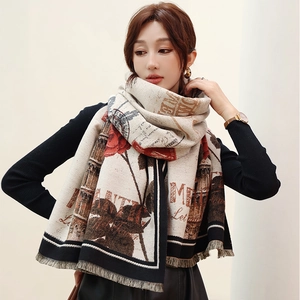 Detail of cashmere-like shawl featuring vintage red rose prints and classic fringe edges