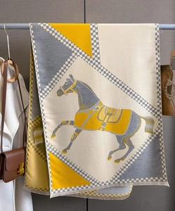 Detail of cashmere-like scarf with vintage horse motif and geometric patterns