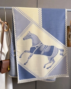 Detail of vintage horse pattern scarf with cashmere feel and geometric patchwork design