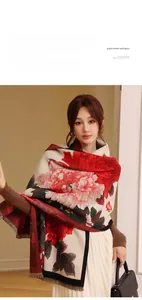 Detail of vintage floral cashmere-like shawl featuring red peonies and delicate fringe edges