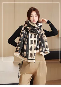 Detailed view of feline pattern scarf in soft faux cashmere with fringe edges