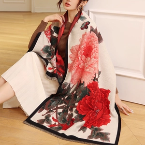 Detail of vintage floral cashmere scarf with red peonies, butterfly patterns and tassels