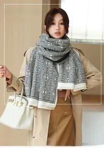 Detail showing the thick imitation cashmere texture and black-white geometric pattern